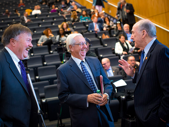 Professor John Farmer, center benefactor Paul Miller, and President Barchi talk before the symposium